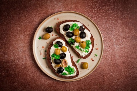 Breakfast, sandwiches, with cream cheese, olives, top view