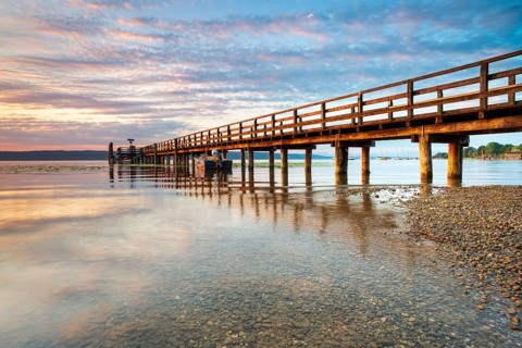 Morning atmosphere at the Lake Ammer, jetty in the first morning light, near Riederau, Bavaria,