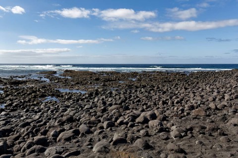Playa de Janubio, black lava beach, volcanic rock, coastline with sea view, Salinas de Janubio,
