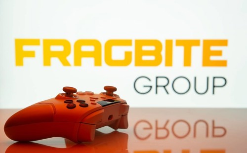 Dhaka, Bangladesh- 20 Mar 2025: A close-up of a white gamepad with the fragbite group seen on