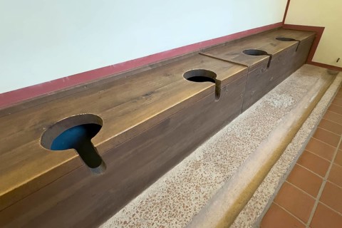 Reconstructed ancient Roman abortion latrine toilet toilet shithouse communal toilet for several