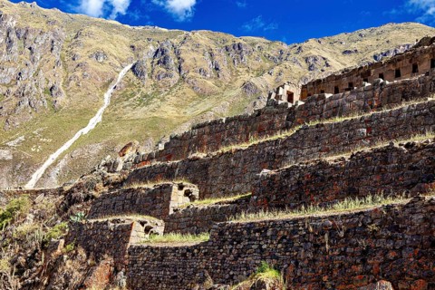 Inca terraces along a steep slope with mountain scenery, The Inca ruins of Ollantaytambo in the