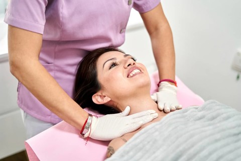 A skilled professional administers a soothing skincare treatment in a beauty salon, enhancing