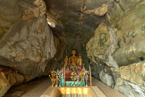 Buddha statue in the elephant cave Tham Xang near Vang Vieng, Laos