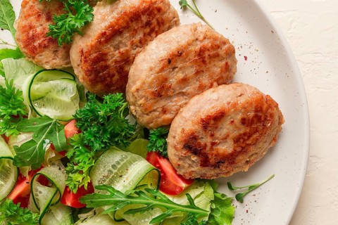 Fried cutlets, turkey, with vegetable salad, top view, no people