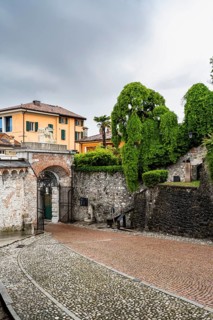 Entrance gate to Castello di Udine Castle, dramatic sky, old town, Udine, Friuli-Venezia Giulia,