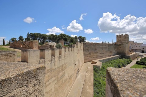 Alcazaba with defensive defence tower and city wall with battlements, historic city fortifications,