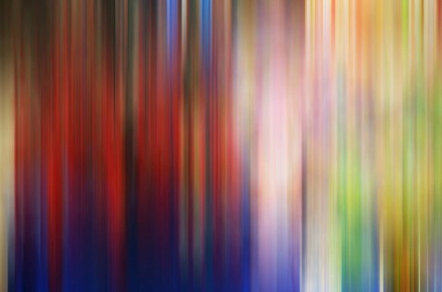 Vibrant, vertical streaks blend seamlessly in this abstract photograph, presenting a splash of