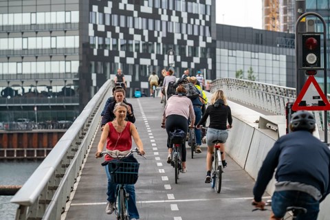 Cyclists on the Bryggebroen cycle and footpath bridge over the harbour, Sydhavnen, Copenhagen is