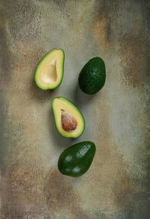 Fresh sliced avocado on the table, top view, food background, concept, menu, food styling