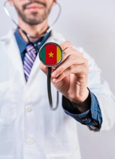 Cameroon health and medical insurance concept. Cameroon healthcare system, doctor holding