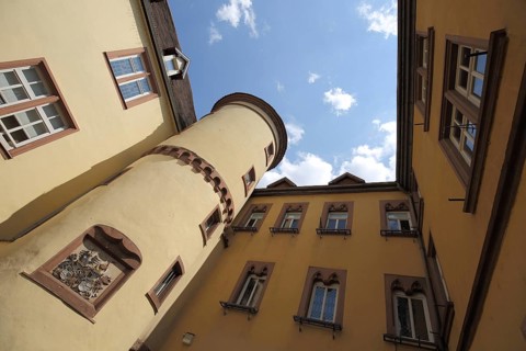 Old town hall with courtyard, corner tower with coat of arms, looking up, Wertheim,