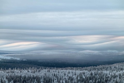 Clouds over forested mountain ranges, Saariselkä, Lapland, Finland, January 2025