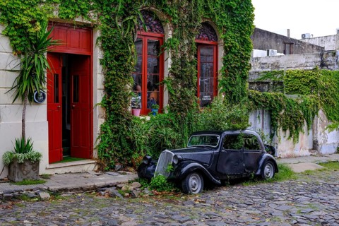 Colonia del Sacramento, Colonia, Uruguay, vintage cars parked in the alleyways of the old town.