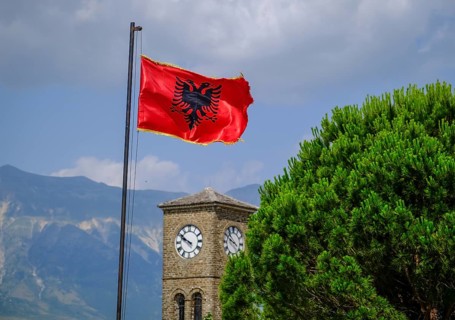 City of Gjirokastra, Gjirokastra, Albania, Albanian flag flies on the castle of the mountain town