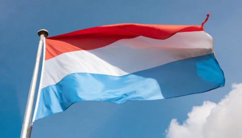 Flags, the national flag of Luxembourg flutters in the wind