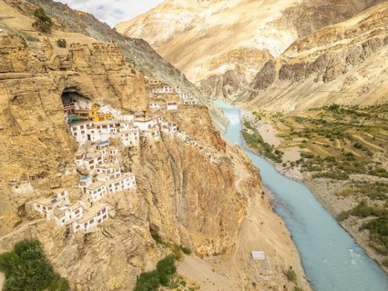 Phugtal Monastery, perched on a cliff in Ladakh's Zanskar Valley, is a serene Buddhist retreat. Its