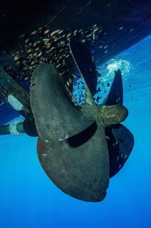 Underwater photo of five-bladed ship's propeller with five blades at a standstill does not rotate,