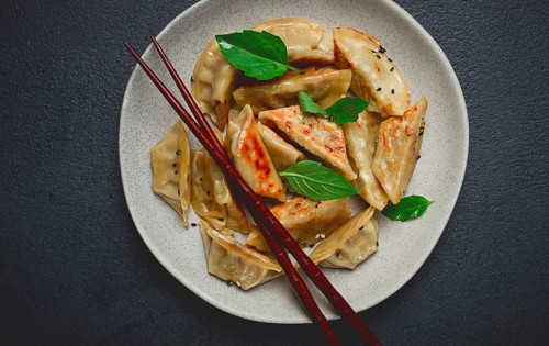 Japanese fried dumplings, gyoza, sesame seeds, top view, no people