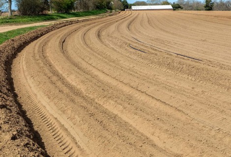 Deep furrows prepared for planting potato crop in sandy soil, Butley, Suffolk, England, UK