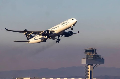 Aircraft climbing in front of the tower, take-off at Fraport Airport. Aircraft registration: