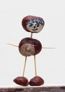 Funny chestnut figure in front of a white wall, North Rhine-Westphalia, Germany