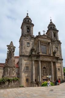 Impressive historic church with two towers and statues in the square in front of it, Convento de