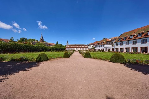 Pleasure garden, garden with lawn, flower beds, path, sand, trees, general buildings, blue sky,