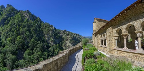 Exterior view of the cloister with small garden at Saint Martin du Canigou Abbey, Casteil,