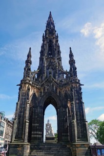 Gothic monument rises into the blue sky in the centre of the city, Sir Walter Scott Memorial,