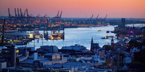 View of the Norderelbe and the harbour from the St. Nikolai memorial during an atmospheric sunset,