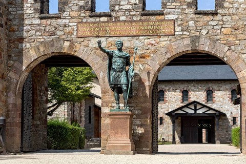 Main gate, Porta Praetoria with bronze statue of Emperor Antoninus Pius, plaque with inscription