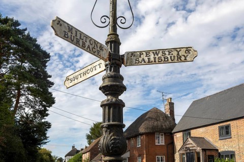 Vintage direction fingerpost pointer street sign in Pewsey, Wiltshire, England, UK