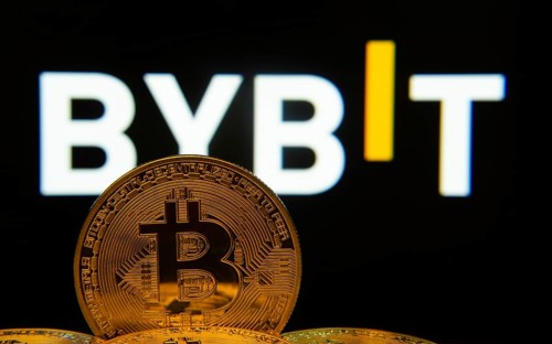 Dhaka, Bangladesh- 15 July 2025: Close-up of Bitcoin coins with the Bybit logo visible on a screen