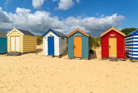 Seaside beach huts on the seafront at Southwold, Suffolk, England, UK
