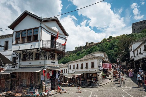 GJIROKASTER, ALBANIA - JUNE 30, 2026: Traditional Albanian street in Gjirokastër with white