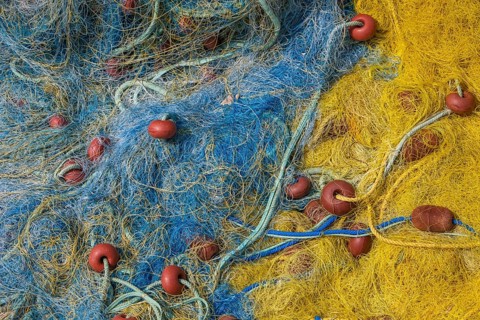 Kassiopi, Corfu, Greece, Colourful fishing nets in the harbour of Kassiopi, a small harbour town in