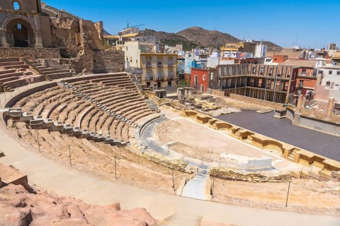 Roman theatre ruins showcasing ancient architecture and historical significance, nestled within the
