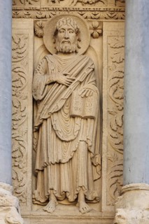 Saint Baratholomew stone sculpture with book and halo, relief, stone carving, handicraft,