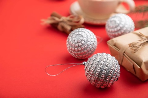 Christmas or New Year composition. Decorations, box, cinnamon, silver balls, fir and spruce