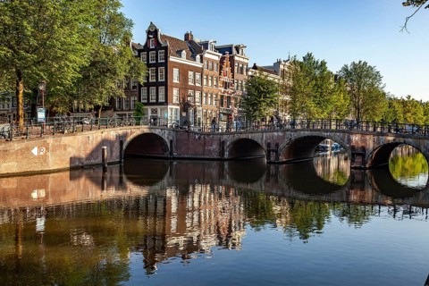 Typical canal in the Dutch capital Amsterdam, North Holland, Netherlands