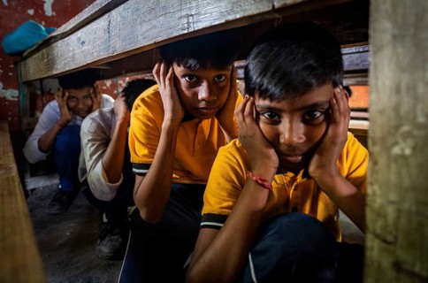 Students take part in a drill as part of a civil defence drill on May 10, 2025 in Guwahati, India