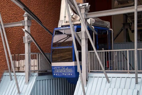 Cable car station with a blue cable car made of metal structures, Teide, Parque Nacional del Teide,