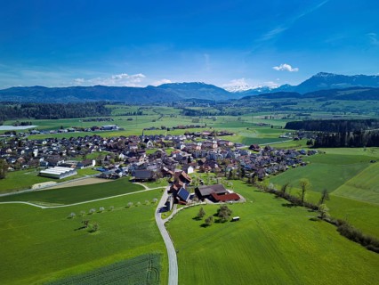View of the village with the Alps with the Rigi in the back, Oberrüti, Freiamt, Canton of Aargau,