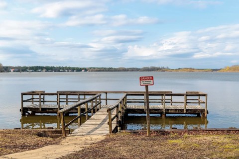 Boat dock along the shore of the Aberdeen Lake section of the Tennessee-Tombigbee Waterway near