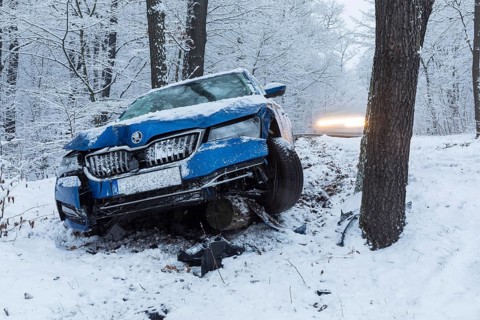Car involved in an accident, car left the road on a bend due to snow and ice, Spitzgrund Coswig,