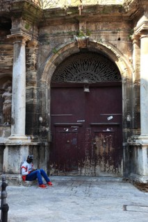 Palermo, main entrance of a morbid house at the square Piazza Bologna in the old town, in front of