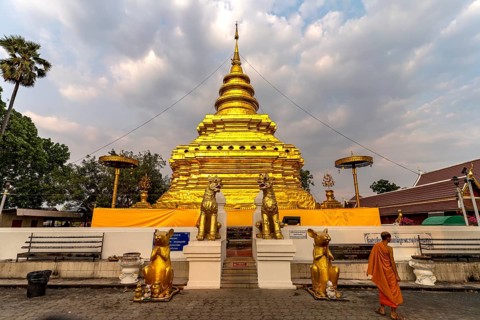 The golden chedi of the Buddhist temple Wat Phra That Si in Chom Thong, Thailand