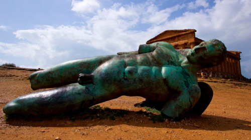 Super wide angle shot, bronze statue of fallen Icarus, Concordia Temple, Valley of the Temples,
