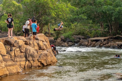 Children jumping into the river Tad Lo, Bolaven Plateau, Laos